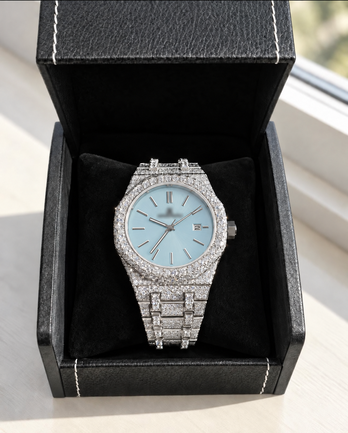 Digital preview: silver-tone octagonal watch with a plain ice-blue dial in a black box