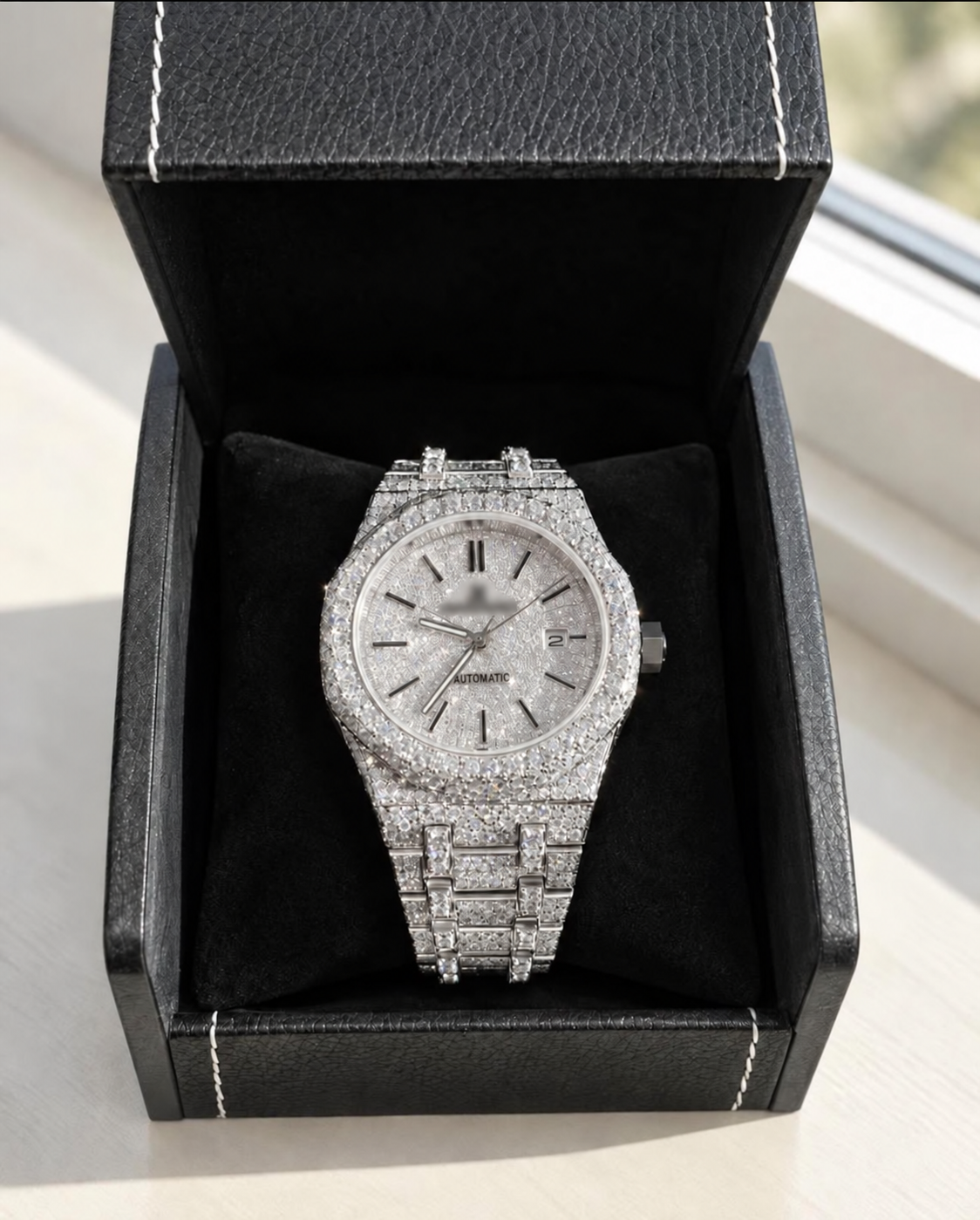 Silver-tone octagonal watch with baton markers, branding blurred