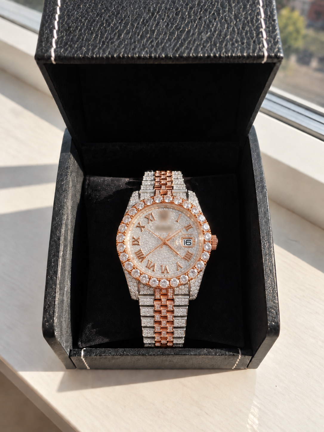 Digital preview: round two-tone rose-gold watch with Roman numerals in a black box